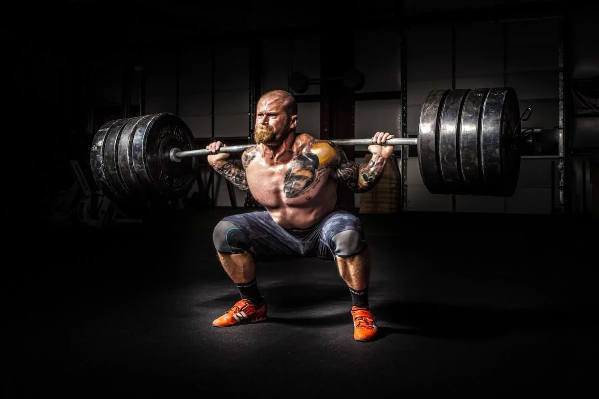 Lifter setting up under a loaded barbell